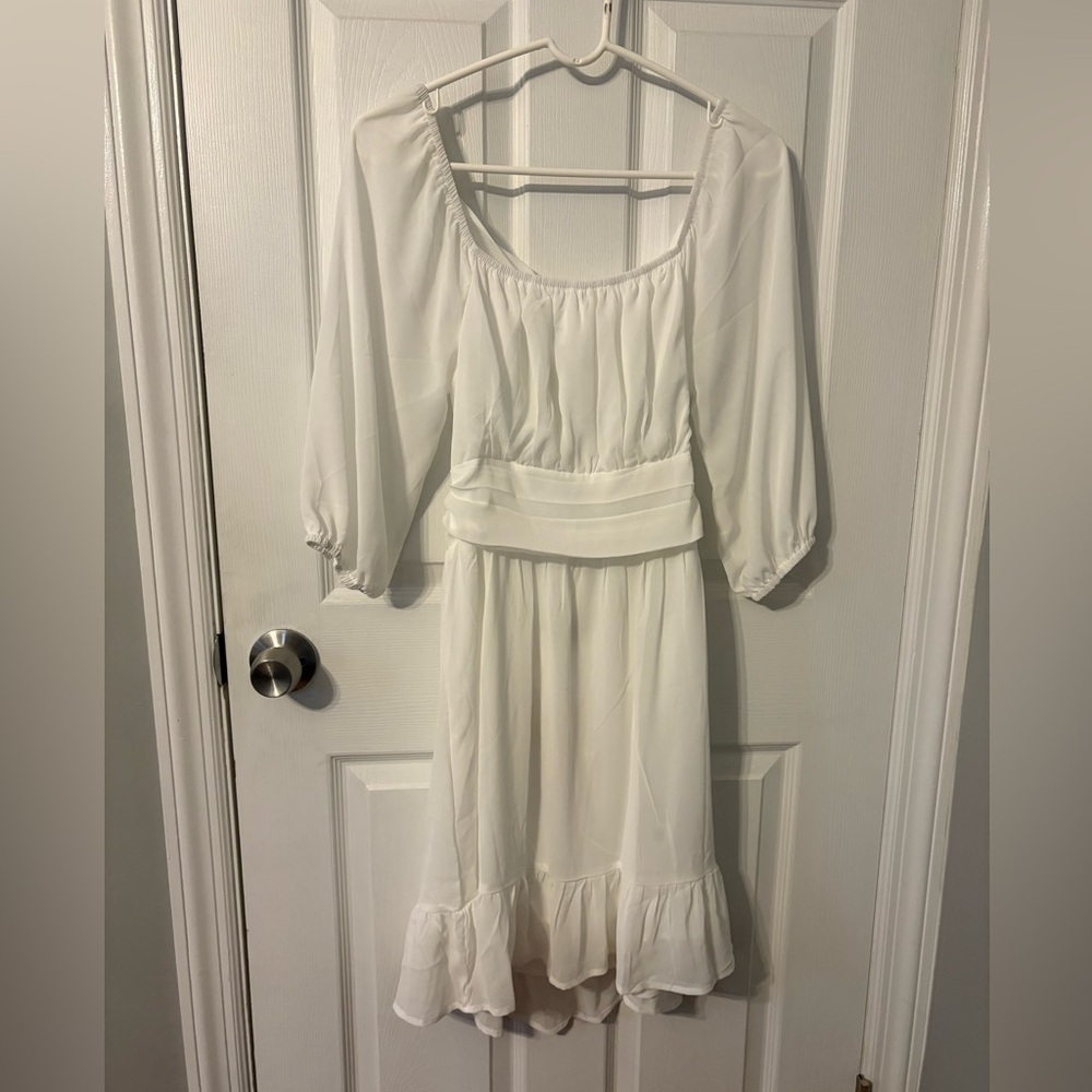 Elegant White Dress with Ruffle Hem